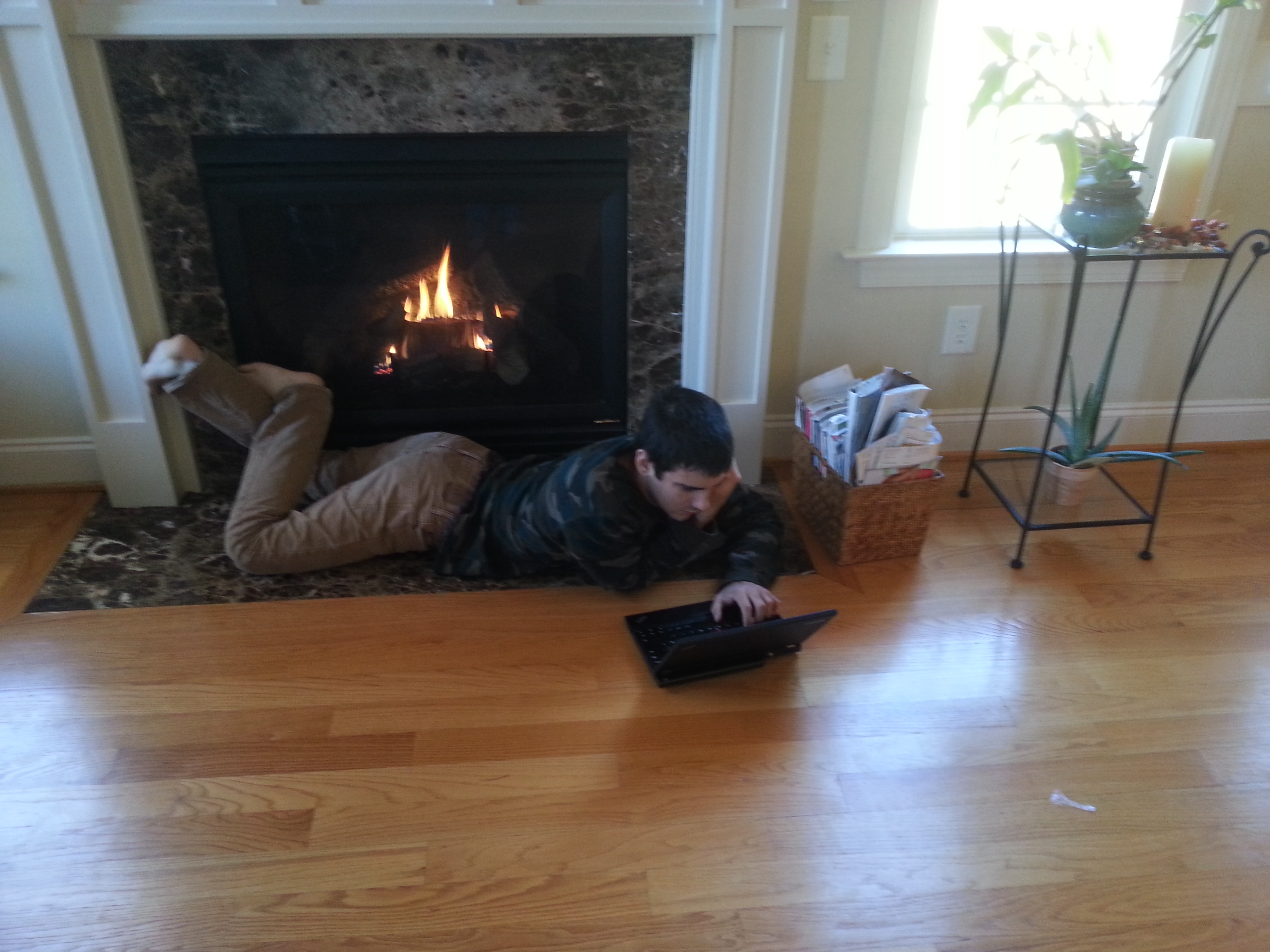 Christian studying by the fire