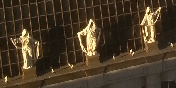 Statues high up on a building in San Francisco