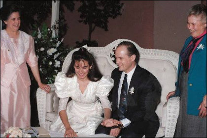 Lorena and Ken sign wedding papers in Monterrey, Mexico 1992