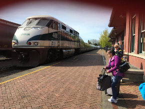 Bob and Gena catching the train to the airport in Seattle