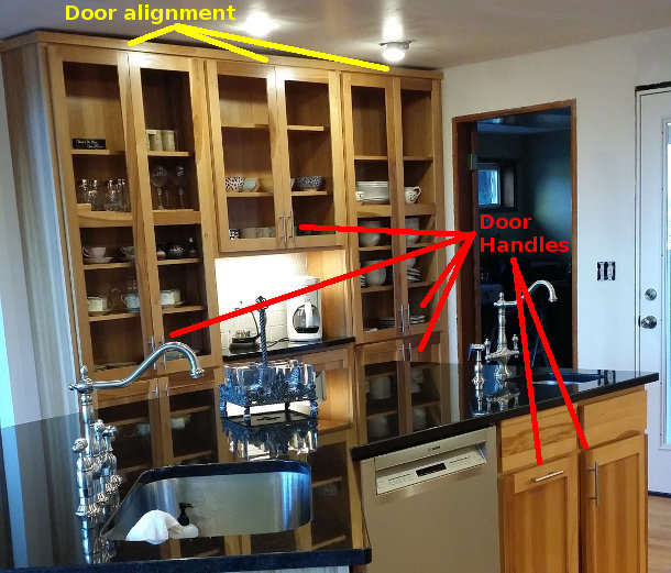 Cabinet doors aligned with door pulls